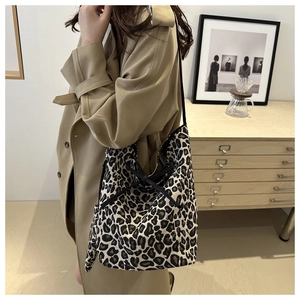 Leopard print tote bag styled with a trench coat for a trendy, casual everyday look