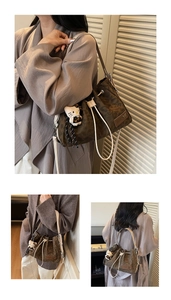 Detail of drawstring bucket bag with leopard print texture and plush charm accessory