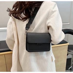 Classic black rectangular flap crossbody bag shown on a model for daily outfit reference