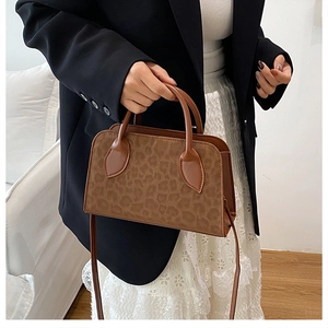 Close-up of leopard print handbag showing vintage pattern and smooth PU leather finish