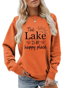 Detail of the lake is my happy place slogan print on orange long sleeve sweatshirt