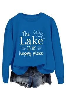 Close-up of royal blue sweatshirt featuring white lake slogan and sun graphic design