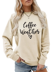Detail of Coffee Weather print and ribbed cuffs on beige crewneck sweatshirt