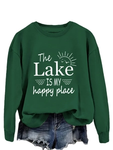 Detail of The Lake is My Happy Place print on a dark green crewneck sweatshirt