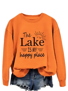 Detail of orange sweatshirt with The Lake IS MY happy place text print and graphics