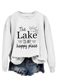 Detail of The Lake Is My Happy Place print on white long sleeve crewneck sweatshirt