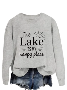 Close-up of 'The Lake IS MY happy place' graphic print on a gray crewneck sweatshirt