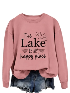 Detail view of pink crewneck sweatshirt featuring The Lake IS MY happy place graphic print