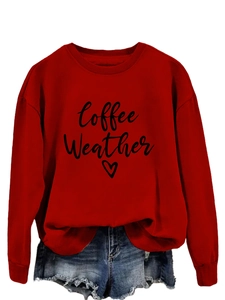 Detail showing red long-sleeve sweatshirt with Coffee Weather print and heart pattern