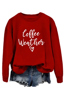 Detail of red crewneck sweatshirt with white Coffee Weather print and heart pattern