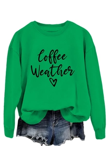 Detail of green Coffee Weather sweatshirt paired with distressed blue denim shorts