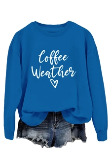Detail of the Coffee Weather heart print on the Klein blue long sleeve sweatshirt