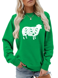 Detail of white sheep floral print on a green crewneck long sleeve sweatshirt