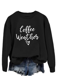 Detail of Coffee Weather print and heart graphic on black crewneck sweatshirt
