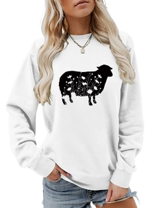 Close-up of white crewneck sweatshirt featuring a black sheep silhouette with floral patterns