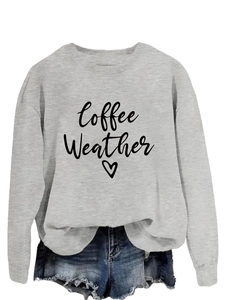 Close-up of Coffee Weather slogan and heart print on light grey cotton sweatshirt