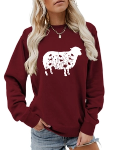 Detail of burgundy crewneck sweatshirt with white sheep and floral print on chest