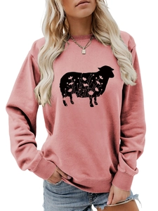 Detail of pink crewneck sweatshirt with black sheep silhouette and floral print pattern