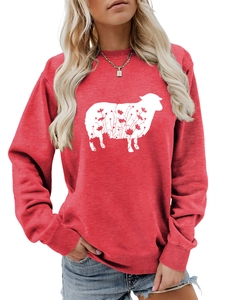 Detail of red crewneck sweatshirt featuring a creative white sheep floral print and ribbed cuffs