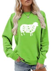 Close-up of grass green sweatshirt featuring a white floral sheep silhouette print