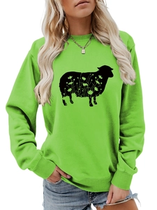 Detailed view of neon green crewneck sweatshirt with black floral goat silhouette print