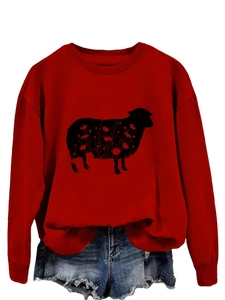 Close-up of red sweatshirt with black sheep floral print and ribbed neckline detail