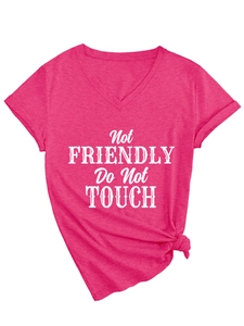 Detail of V-neck fuchsia t-shirt with Not Friendly text and side knot hem design