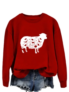 Detail of red crewneck sweatshirt featuring white sheep silhouette with floral patterns