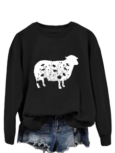 Close-up of black crewneck sweatshirt featuring a white sheep silhouette with floral details