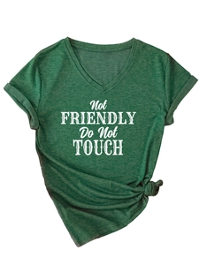 Detail of dark green V-neck T-shirt with 'Not Friendly' slogan and stylish front knot