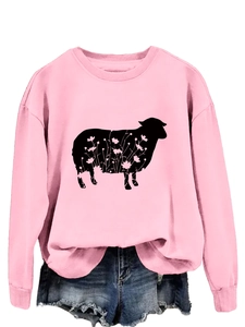 Pink crewneck sweatshirt featuring a black sheep silhouette with floral details and denim shorts