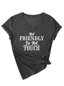 Detail of V-neck grey t-shirt with Not Friendly slogan and stylish side knot design