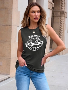 Street style view of dark grey tank top with WARNING! THE GIRLS slogan print