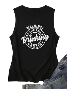 Flat lay of black summer tank top with WARNING! THE GIRLS slogan print and blue denim