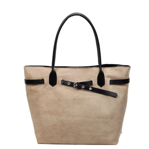 Beige suede tote bag with black leather trim and decorative buckle for women