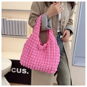 Detail of bright pink bubble texture fabric on a stylish large capacity tote bag