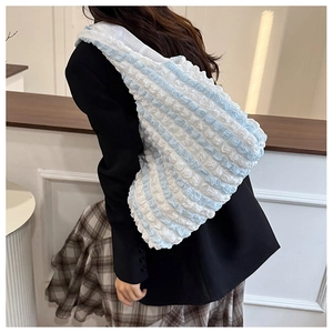 Close-up of blue and white striped popcorn fabric tote bag with pleated bubble texture