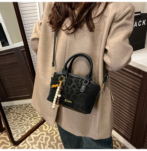 Leopard print crossbody bag with bohemian beaded tassel and JUHAI logo detail