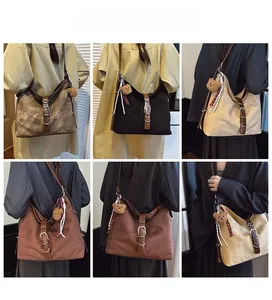 Detailed views of vintage Hobo shoulder bags in multiple colors with bear charms