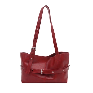 Minimalist large dark red shoulder bag with metallic eyelets and y2k biker style aesthetic