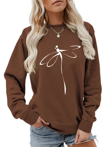 Detail of dragonfly line art print on a dark brown crewneck sweatshirt for women