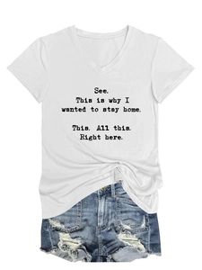 Flat lay of white V-neck T-shirt with quote paired with ripped denim shorts