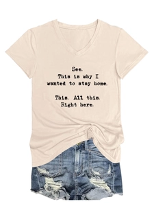 Detail view of v-neck apricot cotton t-shirt with funny slogan and denim shorts