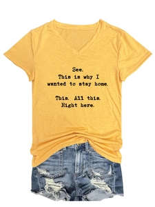 Detail of yellow V-neck T-shirt with 'See. This is why I wanted to stay home' slogan
