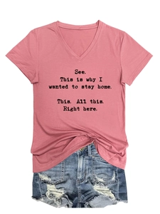 Flat lay of pink V-neck T-shirt with quote text and distressed denim shorts