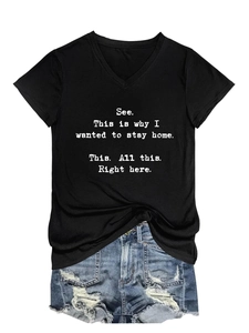 Detail of V-neck black T-shirt with white printed slogan and distressed denim shorts
