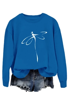 Close-up of minimalist white dragonfly line art printed on a bright blue sweatshirt