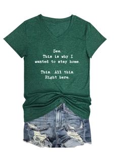 Detail of V-neck dark green cotton blend t-shirt featuring a white typography print
