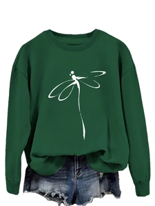 Close-up of minimalist white dragonfly print on dark green crewneck sweatshirt fabric