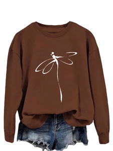Detail of dragonfly line art print on a brown crewneck long sleeve sweatshirt